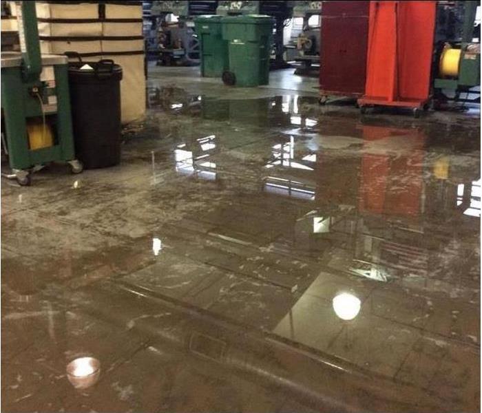 Inside of water damaged warehouse; water on floor